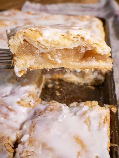 a close up of a pastry on a pan with a fork