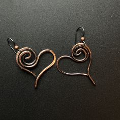 "Piece Name: Loopy Hearts We hand-formed these earrings from solid copper wire and gave them an antiqued finish.  They hang from niobium wires for those with skin sensitive to copper. They measure 1 1/4\" long x 1\" wide." Aluminum Earrings, Antique Finish, Copper Wire, Heart Earrings, Sensitive Skin, Copper, Jewelry Earrings, Etsy Shop