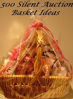 a basket filled with assorted items on top of a white table next to the words, 500 silent auction basket ideas