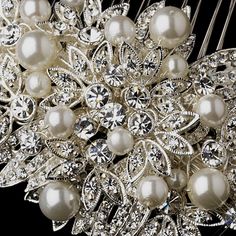 a bridal hair comb with pearls and crystal stones on the front, in silver tone