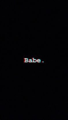 the word babe is lit up on a dark background with red and blue letters in it