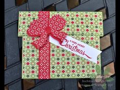 a close up of a christmas card with a bow on it's front and side