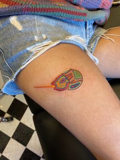 a person with a tattoo on their thigh