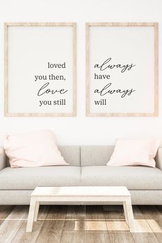 two framed art prints on the wall above a couch in a living room with wood flooring