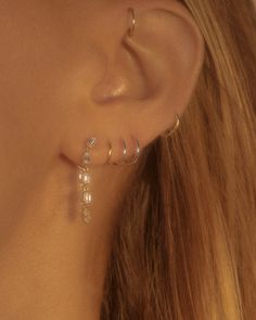 Our Emerald Cut Ballier Studs are our unique take on a statement stud earring. They make the perfect diamond piece if you want a stud but also a hoop shape with their delicate design and subtle sparkle. Available in emerald-cut diamonds that are ethical & lab grown with the most precious metals, you'll never want to take them off Silver 14k Gold Pierced Huggie Earrings, White Gold Dangle Huggie Earrings Fine Jewelry, Fine Jewelry With Diamond Cut Dangle, Fine Jewelry Huggie With Diamond Accents, Diamond Teardrop Huggie Earring, Modern Diamond White Huggie Earrings, 14k Gold Huggie Jewelry With Diamond Accents, Modern Diamond White Huggie Jewelry, Individual Diamond Dangle Huggie Earrings