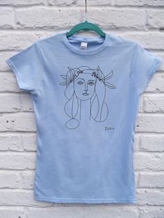 "BRAND NEW PRINTED T-SHIRT Heat transferred T-SHIRT Treat yourself or yours friends original gift! DESIGN: Picasso Woman drawing - Woman's T-shirt. This item is new 100% high quality cotton material. Our T-shirts sized S-2XL (size guide- see photo) are very soft and lightweight. We are sure that you will love the perfect balance of comfort and flattering. The spectrum of styling possibilities is almost endless whether you tie a knot or roll up the sleeves, your imagination - your choose. All our products are made with love and attention to their future owner. YOU HAVE TO BEAR IN MIND THAT T-SHIRTS ARE \"FIT\" SIZE. IF YOU WOULD LIKE TO HAVE THEM LOOSE FIT NEED TO CONSIDER THE BIGGER SIZING.  CHECK THE SIZE CHART (IN CM), IT WILL HELP YOU CHOOSE THE SIZE. MATERIAL:  100 % Cotton T-shirts, G Artistic Blue Crew Neck Tops, Artistic Blue Crew Neck T-shirt, Artistic Blue T-shirt With Screen Print, Artistic Blue Cotton T-shirt, Artistic T-shirt With Funny Print And Crew Neck, Picasso Woman, Woman Drawing, White Shirts, Bold Prints