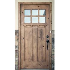 a wooden door with glass panels on the front and side doors are made out of wood