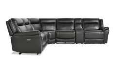 a black leather sectional sofa with two recliners and one chair in the middle