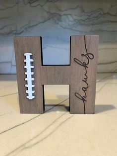 This handmade piece is a great coaches gift. It is large enough to have a team sign the back. The letter is a beautiful addition to an office or home. This crafted decor piece is self standing. (Some letters include a base) It measures approximately 12 inches x 11 inches x 1 inch. Personalized Coach Gifts, Football Coach Gifts, Football Banquet, Football Coach, Football Gifts, Coach Gifts, Thank You Gifts, A Team, Hanging Signs