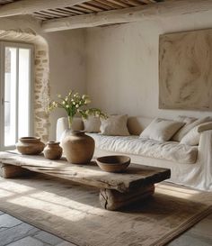 a living room filled with lots of furniture and decor on top of a wooden table