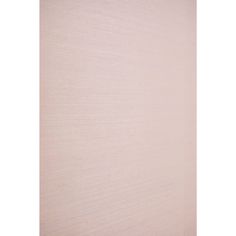 a white wall that has some kind of textured paper on it and is very light pink