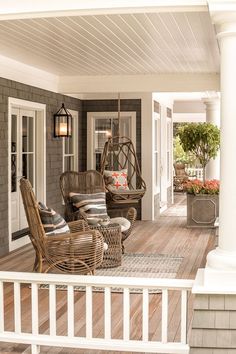 a porch with wicker furniture on it