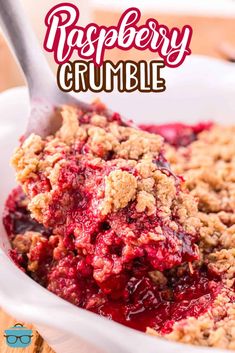 raspberry crumble in a white bowl with a spoon