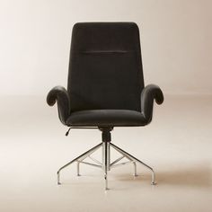 a black office chair sitting on top of a white floor