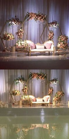 the stage is decorated with flowers and greenery