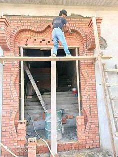 a man standing on top of a brick building