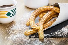 some churros and coffee on a table