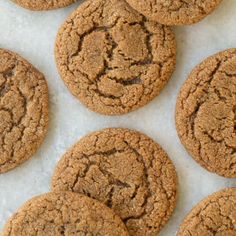 several cookies are arranged on a white surface