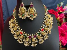 Temple Jewelry Kemp Antique Gold Finish /Goddess Laxmi Necklace & Earring Set/Temple Jewelry This item is perfect for parties and festivals! DETAILS: Includes one necklace and two earrings. Necklace: 16.4 long total 20 inches. Adjustable length. Chain Closure. Weighs 2.75oz (73g). Earrings: 2. inch(es) long. Earring set weighs 60oz ( 17g). Earring backs push on/off. Material: Imitation Antique gold Finish Pearls Beads /Kemp Rubies, and Emeralds CZStones. Finish: Premium Antique Gold finish. NOTE Multicolor Temple Necklace For Festivals, Festive Spiritual Multicolor Temple Necklace, Gold Temple Necklace For Diwali Party, Festive Multicolor Spiritual Temple Necklace, Festive Multicolor Temple Necklace For Parties, Multicolor Temple Necklace For Party, Temple Jewelry Sets For Diwali Party, Multicolor Temple Necklace For Parties And Festivals, Diwali Temple Jewelry Sets For Party