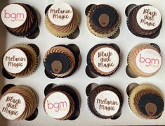 twelve chocolate cupcakes with white frosting and brown icing, decorated with the word bgm