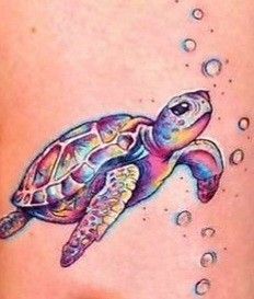 a woman's stomach with a tattoo of a turtle and bubbles on the side