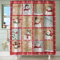 a christmas themed shower curtain with snowmen