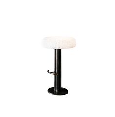 a black metal bar stool with a white fur covered seat and foot rest, against a white background