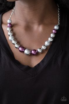 A collection of oversized silver and pearly purple and gray beads drape across the chest for a refined look. Features an adjustable clasp closure. All Paparazzi Accessories are lead free and nickel free! Sold as one individual necklace. Includes one pair of matching earrings.