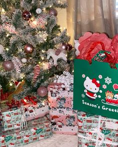 christmas presents under the tree with hello kitty on them