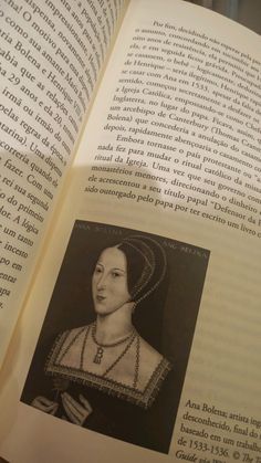 an open book with the image of a woman wearing a tiara and pearls on it