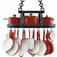 pots and pans are hanging from the rack