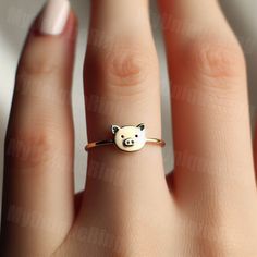 *Free engravings up to 20 characters* 🐷 Step into whimsical elegance with our delightful Gold Women's Pig Ring! 🌸 👑 Make a charming statement with this adorable piece, meticulously crafted with precision and passion. Designed for the modern woman who adores the sweetness and innocence of farm life. 🌿 🌟 Handcrafted from high-quality 10k gold, this dainty ring features a detailed pig design, capturing the playful and endearing nature of these beloved animals. 💫 💖 The pig symbolizes abundance, prosperity, and good fortune, making this ring a perfect accessory for those who seek joy and happiness in the simple pleasures of life. 🌼 🎁 Whether it's a treat for yourself or a cherished gift for someone special, this women's pig ring is sure to bring smiles and become a cherished addition t Pig Bracelet, Pig Ring, Pig Jewelry, Pig Design, Zierlicher Ring, Pig Lovers, Ring Dainty, Gift Jewelry, Joy And Happiness