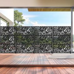 an outdoor area with wood flooring and decorative screen on the side of the building