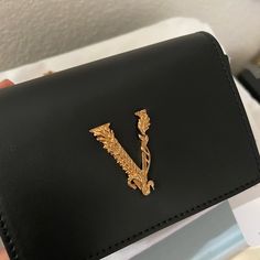 New. Comes With Boxes, Dust Bag, Cards Proof Of Purchase If You Want To See Luxury Rectangular Wallet On Chain As Gift, Luxury Black Rectangular Wallet On Chain, Designer Black Rectangular Wallet On Chain, Luxury Wallets With Gold-tone Hardware As Gift, Luxury Black Wallet On Chain For Party, Versace Bag, Versace Wallet, Versace Bags, Black Clutch