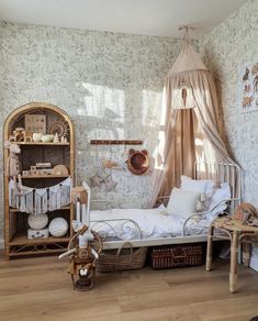 a room with a bed, shelves and baskets on the floor in front of it