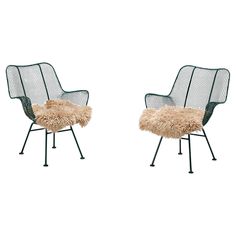 two chairs with sheepskin on them sitting side by side in front of each other