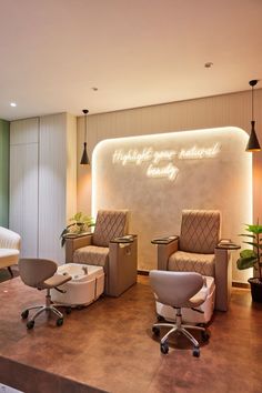 a salon with chairs and lights in front of a sign that says highlight your natural beauty