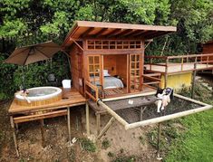 an outdoor hot tub and jacuzzi set up in the grass