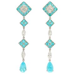 The quintessential shoulder duster earrings, featuring the most sought after tourmalines from Paraiba, Brazil. The matching pear shape Paraibas are mounted with very high quality emerald cut and marquise diamonds as well as smaller round Paraibas. At 2 5/8 inches (6.7cm) long they will never fail to impress. A completely one of a kind design. 2 pear shape Paraiba tourmalines total weight 3.95cts 40 round Paraiba tourmalines total weight 3.06cts 2 emerald cut diamonds 1.01cts each, both GIA certi Shoulder Duster Earrings, Duster Earrings, Brilliant Cut Diamond Ring, Rings Luxury, Tourmaline Earrings, Mini Earrings, Paraiba Tourmaline, Earrings Diy, Diamond Jewelry Designs