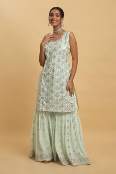 Green pastel kurta featuring silver zardozi embroidered floral vine motifs, embellished by sequins. Comes with embellished sharara and dupatta. - Aza Fashions Traditional Silver Sharara For Designer Wear, Silver Sharara For Designer Wear And Eid, Silver Designer Wear Sharara For Eid, Designer Silver Sharara For Eid, Silver Designer Sharara For Diwali, Silver Sharara For Diwali Designer Wear, Silver Sharara With Zari Work For Eid, Designer Silver Sharara With Resham Embroidery, Silver Resham Embroidery Floor-length Sharara