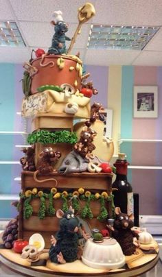 there is a very large cake with many animals on it