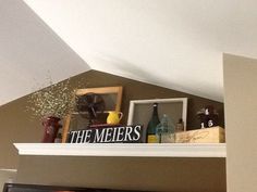 there is a sign that says the meers on top of a shelf in a room