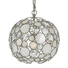 a chandelier hanging from the ceiling with clear glass balls and metal chains around it