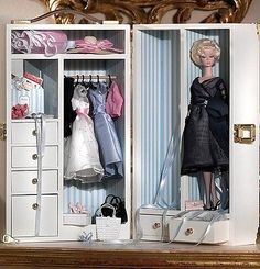 a barbie doll is standing in a closet