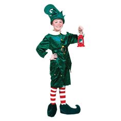 a young boy dressed in a green costume and striped socks, holding a red ornament