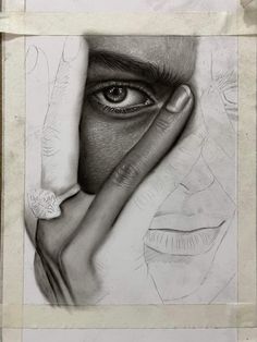 a pencil drawing of a woman's face with her hand over her eye