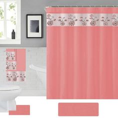 a bathroom with pink and white decor on the shower curtain, toilet seat cover, rug and bathtub