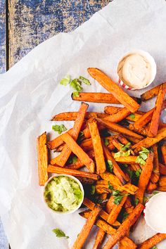 sweet potato fries with avocado dip and sour cream on the side for dipping