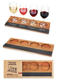 three glasses of wine sitting on top of a wooden tray