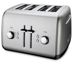 a silver toaster sitting on top of a white table